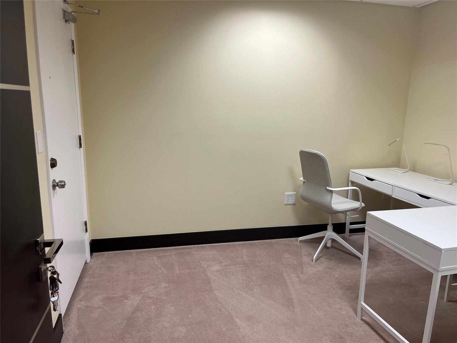 A small office space features beige walls, dark baseboards, tan carpeting, and white furniture — 2730 SW 3rd Avenue # 202C, Miami FL 33129, MIAMI, FL
