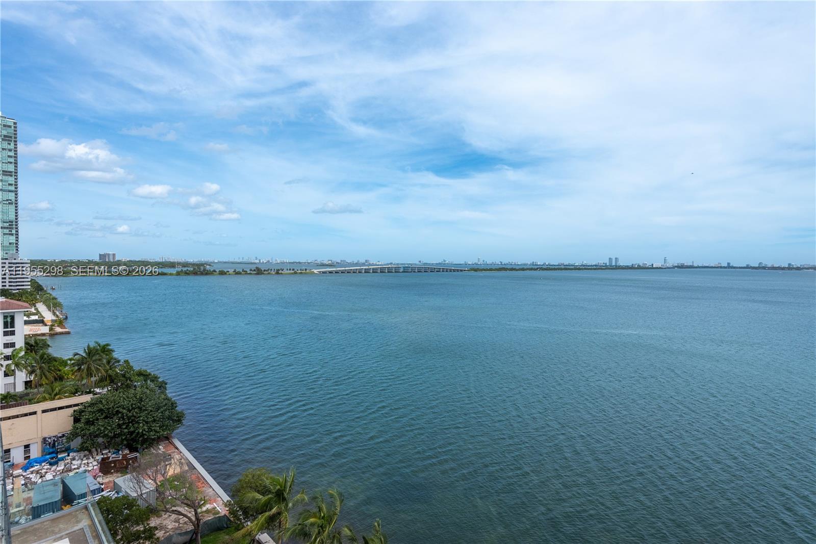 An elevated view of a bay with a long bridge and distant city skyline — 700 NE 26th Ter # 903, Miami FL 33137, MIAMI, FL