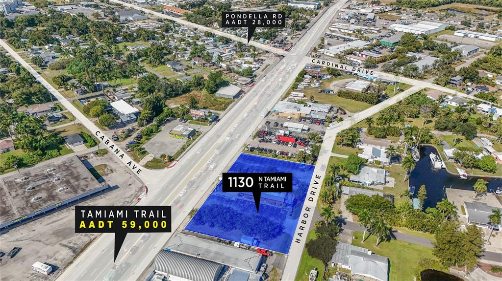 An aerial view shows a highlighted commercial property lot situated between two major roads — 1130 N TAMIAMI TRAIL, NORTH FORT MYERS, FL