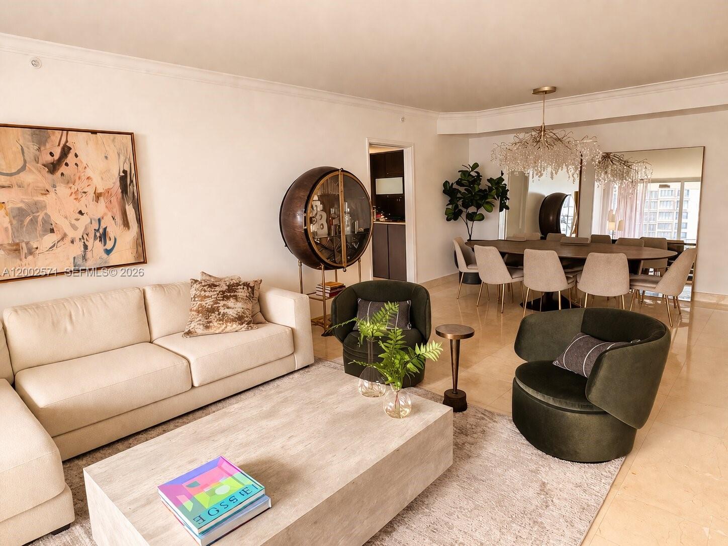 A living and dining area features a cream sofa, two green chairs, and a chandelier — 848 Brickell Key Dr # 905, Miami FL 33131, MIAMI, FL