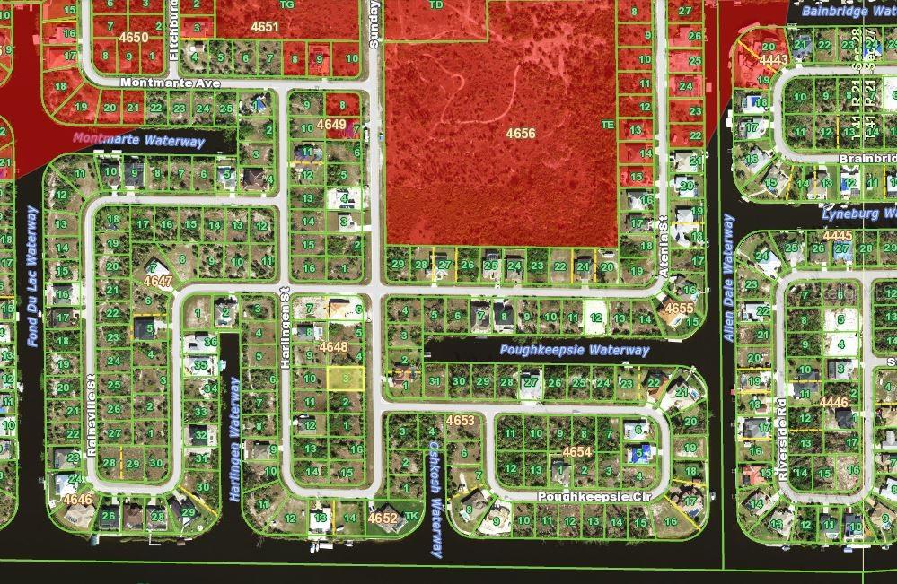 This is a map showing the layout of residential lots and waterways in a neighborhood — 10461 SUNDAY DRIVE, PORT CHARLOTTE, FL