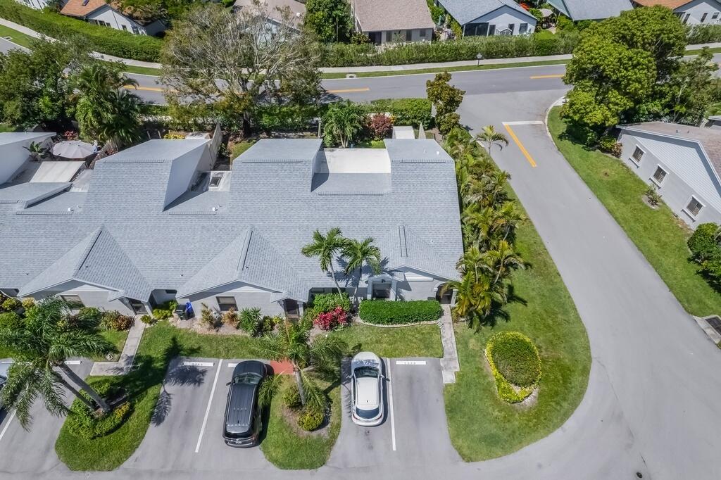 An aerial view shows a grey-roofed townhouse with two parked cars in front — 1260 NW 24th Avenue, Delray Beach FL 33445, DELRAY BEACH, FL