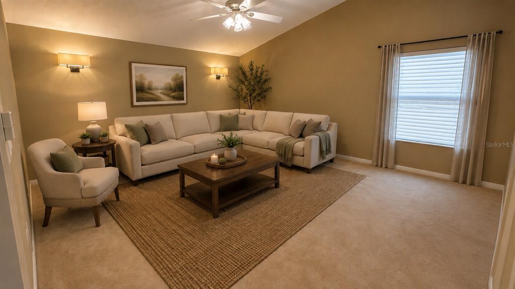 A living room features a sectional sofa, an armchair, a coffee table, and beige carpeting — 649 BUCKINGHAM DRIVE, OVIEDO, FL