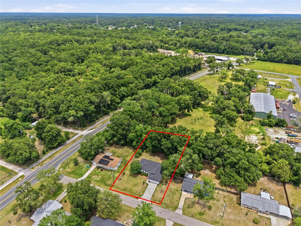 An aerial view shows a single-story house outlined in red on a wooded residential lot — 18145 NW 250TH TERRACE, HIGH SPRINGS, FL
