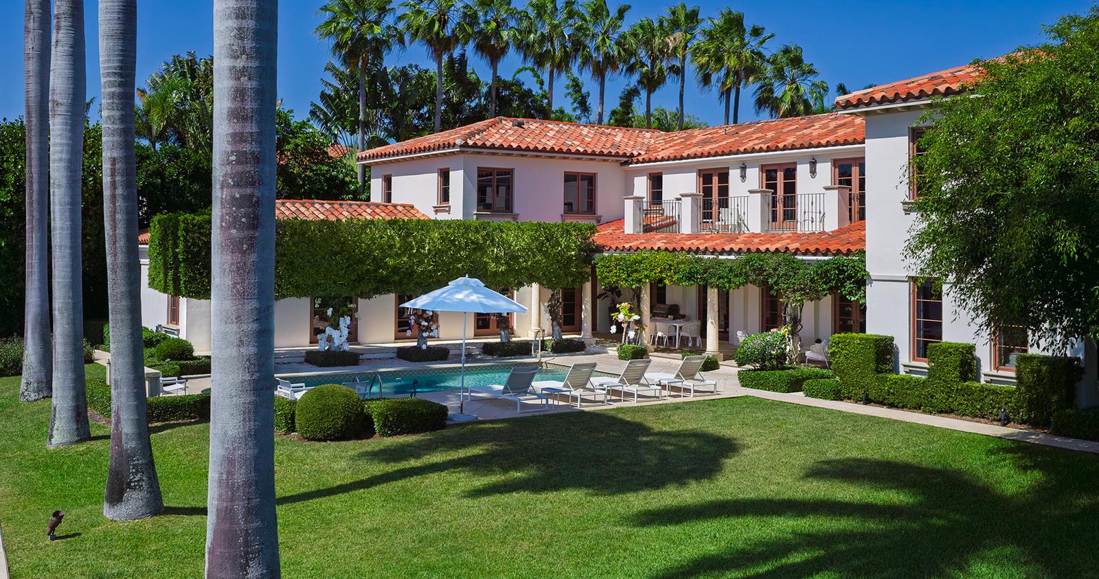 A two-story Mediterranean-style house with a red tile roof, swimming pool, and manicured lawn — 614 Tarpon Way, Palm Beach FL 33480, PALM BEACH, FL