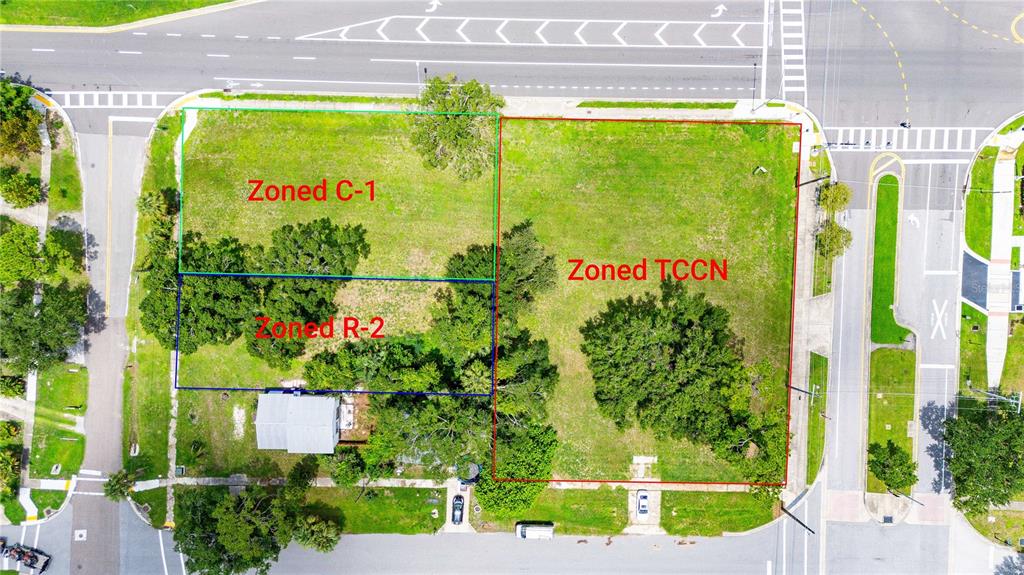 An aerial view shows three adjacent land parcels with different zoning designations — 205 CHESTNUT STREET, OLDSMAR, FL