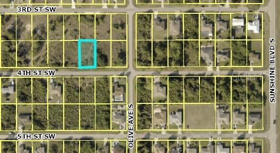 This is an aerial map showing a highlighted vacant lot in a residential neighborhood — 3204 4TH STREET SW, LEHIGH ACRES, FL