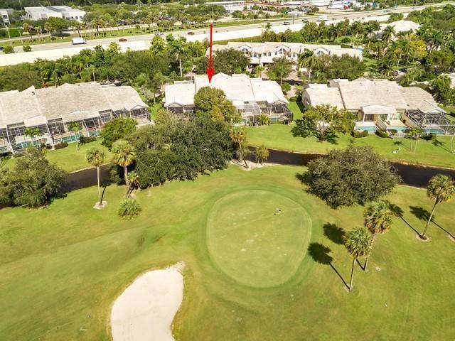 An aerial view shows a residential complex situated along a golf course green and bunker — 676 W Palm Aire Drive, Pompano Beach FL 33069, POMPANO BEACH, FL