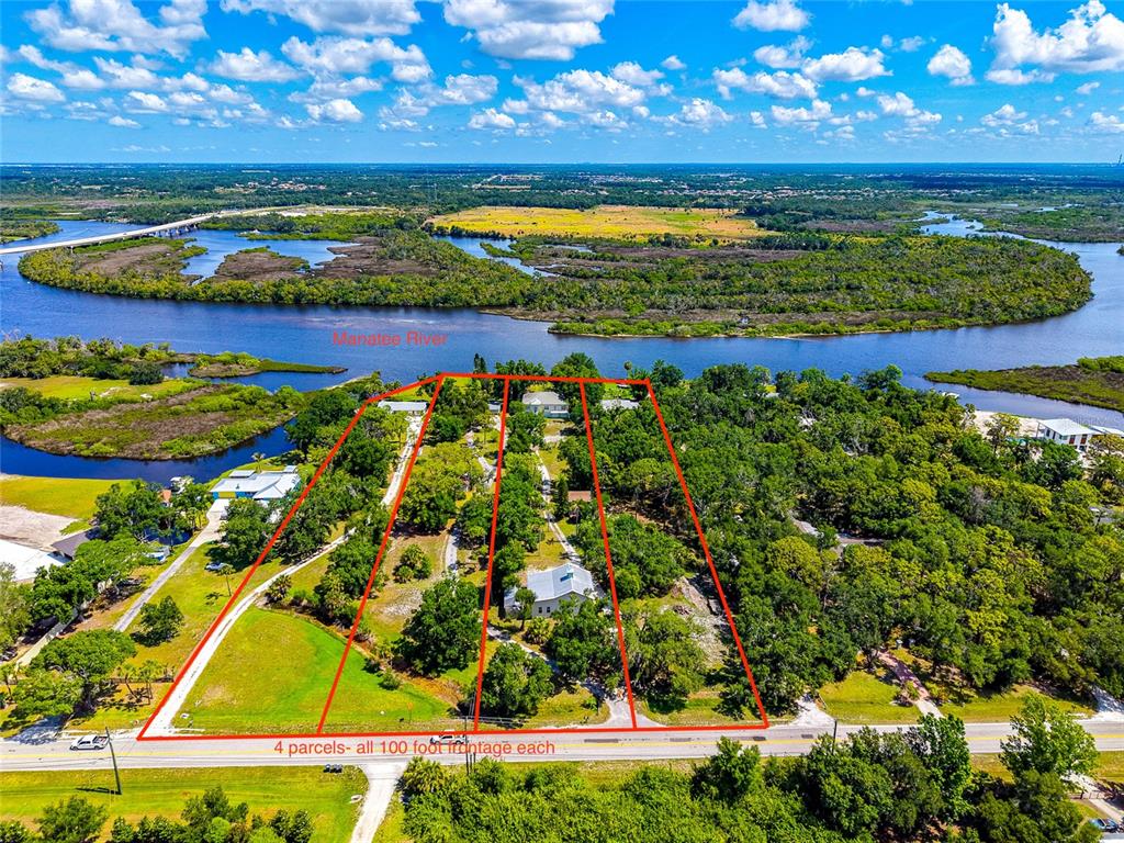 An aerial view shows four adjacent land parcels with river frontage and scattered trees — 11903 UPPER MANATEE RIVER ROAD, BRADENTON, FL