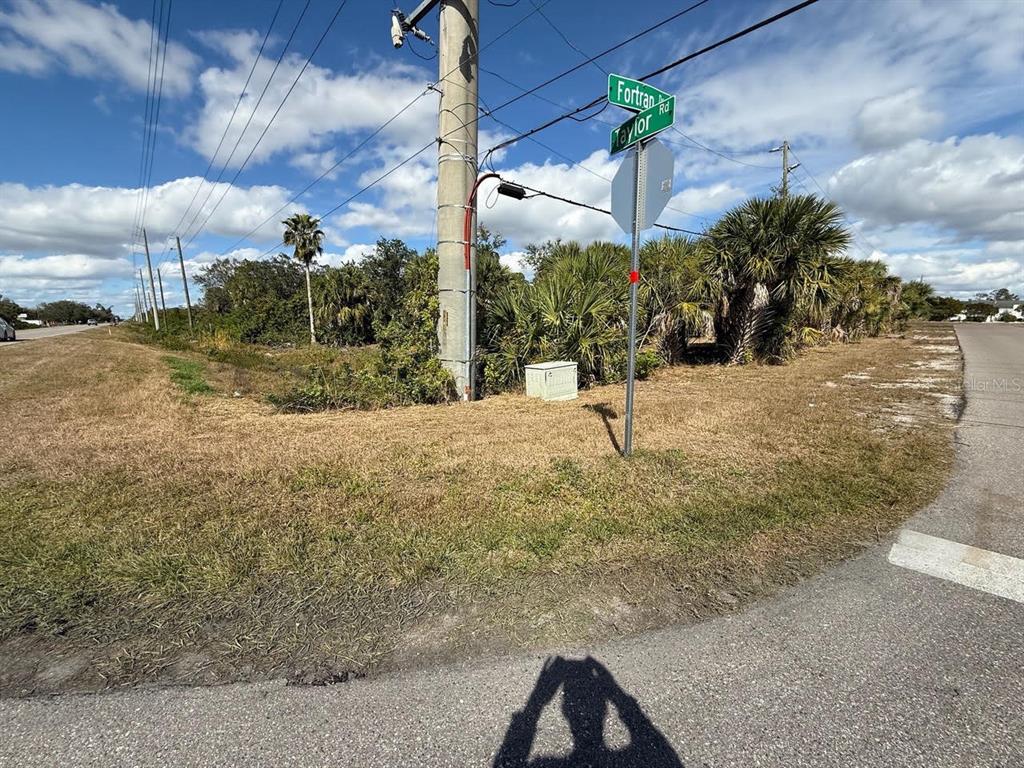 A street corner with a utility pole and road signs for Fortran Road and Taylor — 25360 FORTRAN DRIVE, PUNTA GORDA, FL