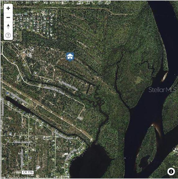 This is an aerial map view of a residential area near a river and forest — 1228 HARBOUR HIBISCUS COURT, PUNTA GORDA, FL