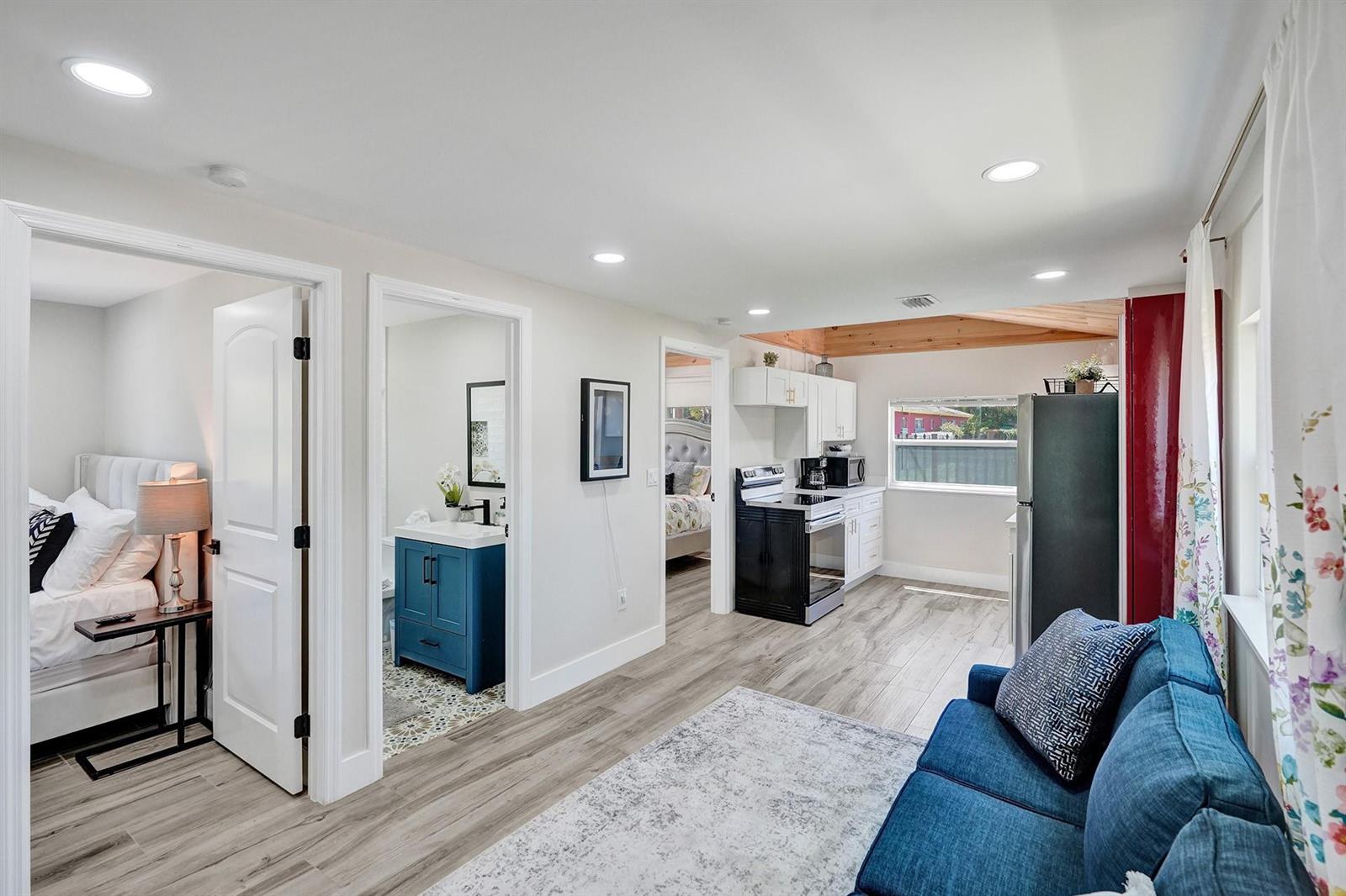 A living area with a kitchen, bathroom, and bedroom visible through open doorways — 8021 NW 1st Place # 1, Miami FL 33150, MIAMI, FL