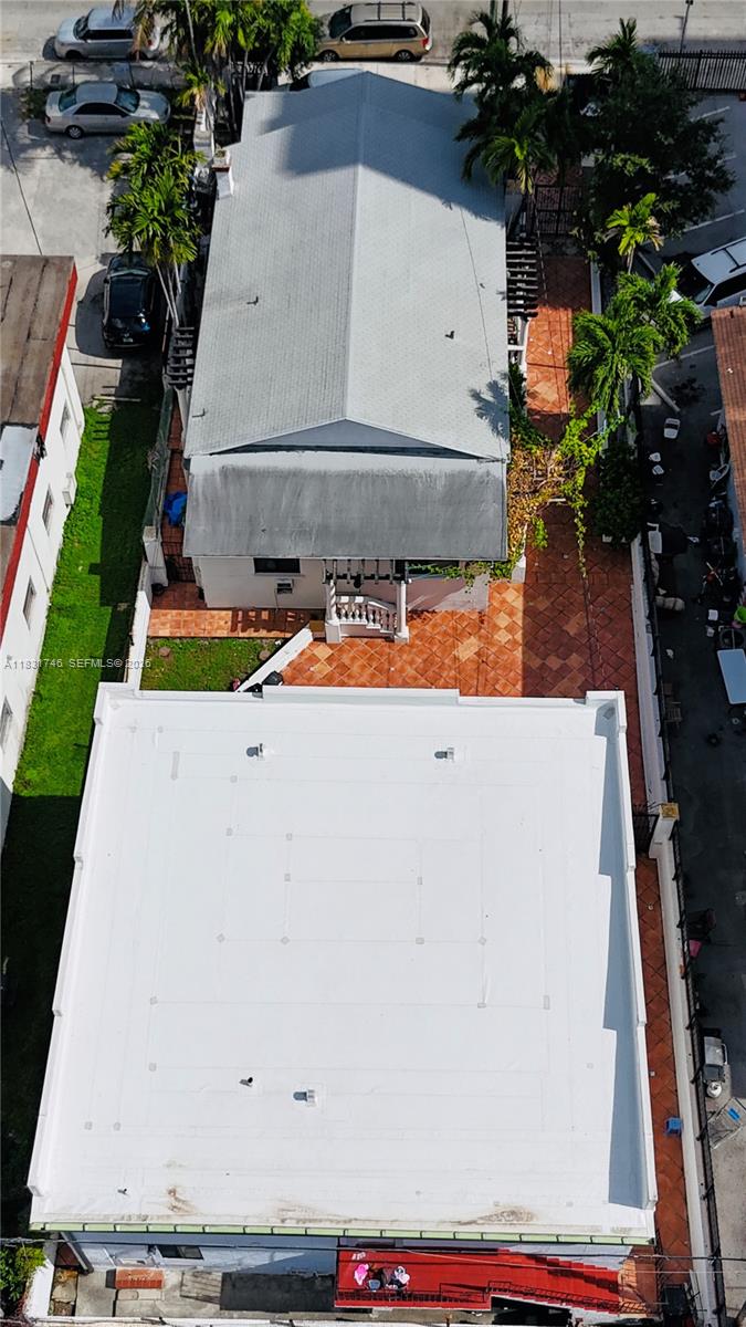 An aerial view shows two adjacent buildings with a tiled courtyard and surrounding palm trees — 1236 SW 4th St, Miami FL 33135, MIAMI, FL