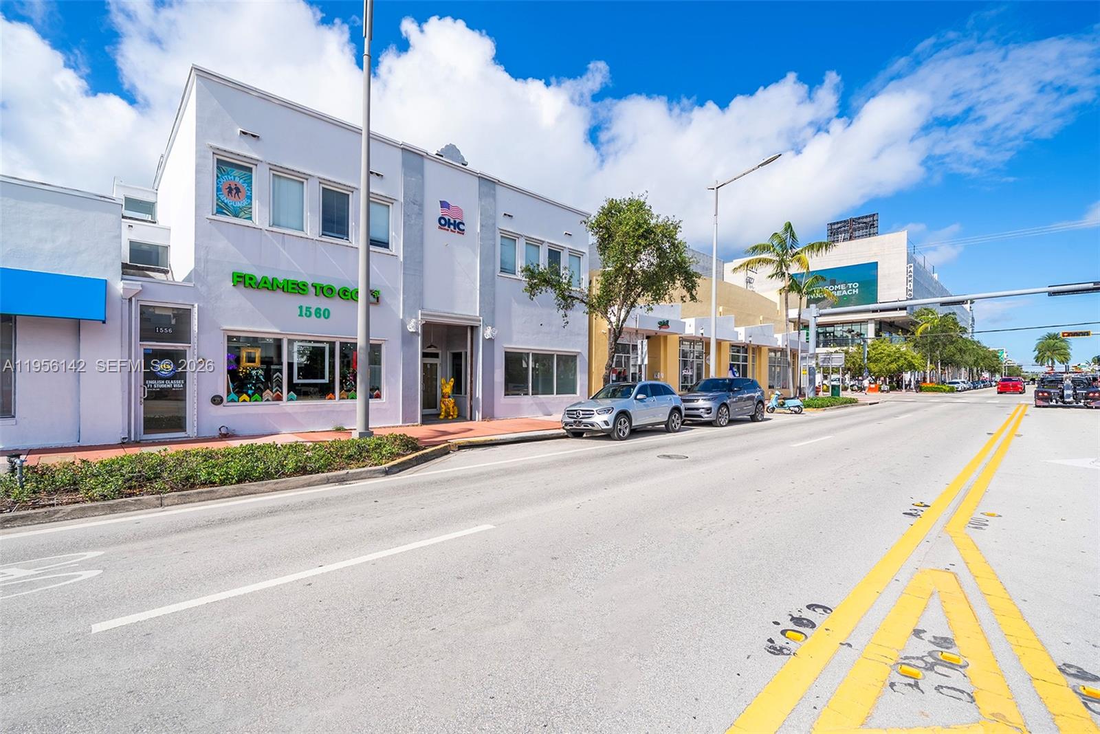 A street-level view shows a white commercial building with a storefront next to parked cars — 1558 Alton Rd, Miami Beach FL 33139, MIAMI BEACH, FL