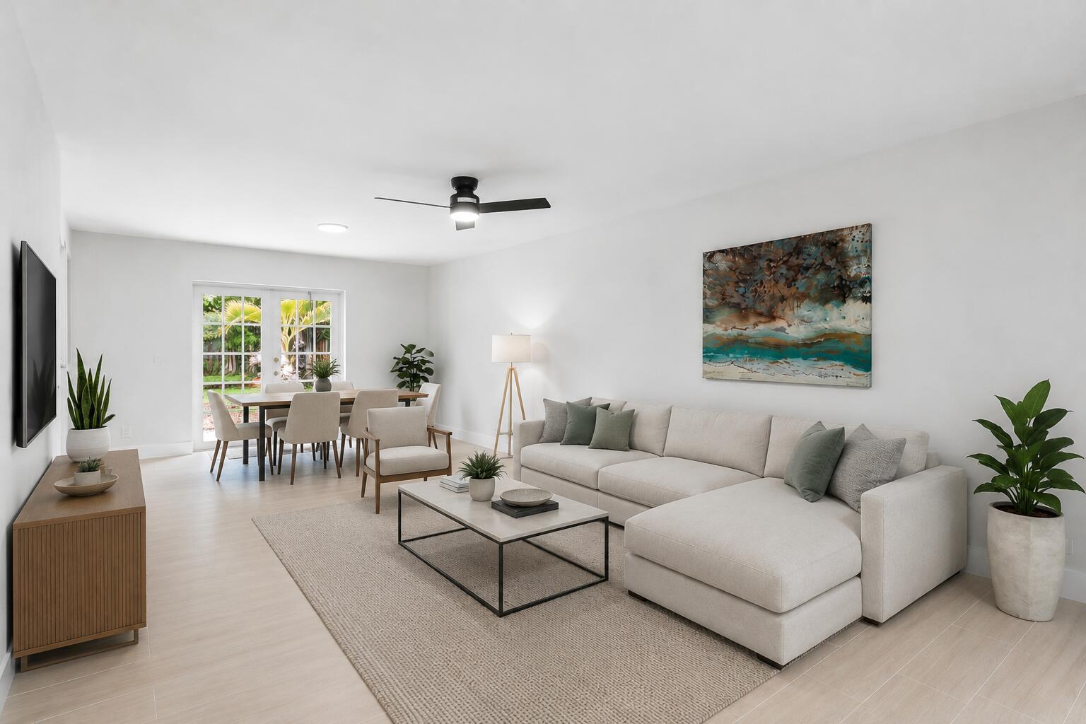 A bright living and dining room with white walls, light flooring, and modern neutral furniture — 5119 Oak Hill Road, Delray Beach FL 33484, DELRAY BEACH, FL