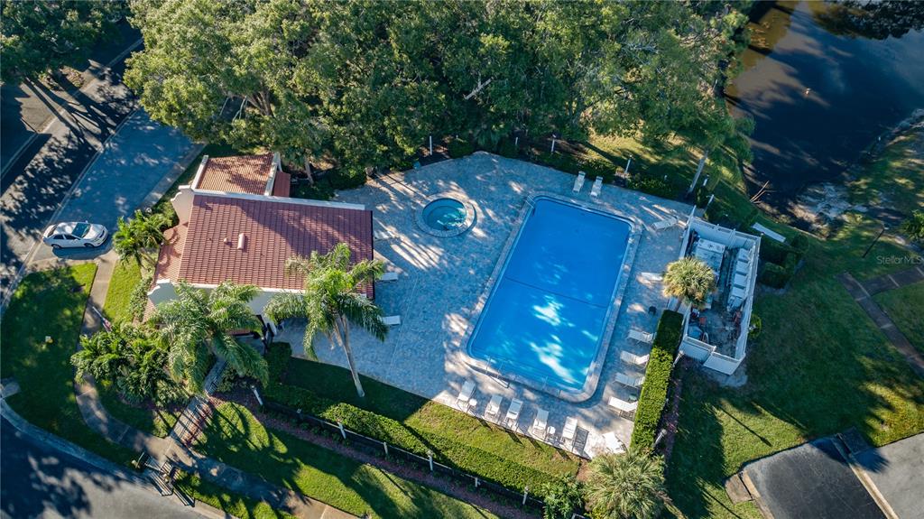A two-story residential building with a stucco exterior, a red tile roof, and a staircase — 3505 TARPON WOODS BOULEVARD UNIT O-403, PALM HARBOR, FL