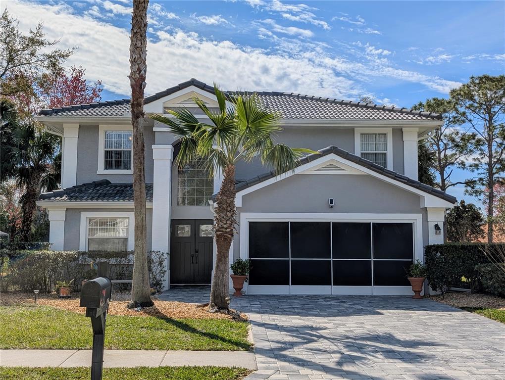 A paved patio with a swimming pool is enclosed by a screened-in lanai — 9 MOUNT VERNON LANE, PALM COAST, FL