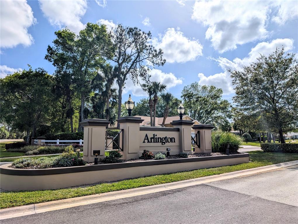 A beige monument sign with the word Arlington stands at the entrance of a neighborhood — 9 MOUNT VERNON LANE, PALM COAST, FL