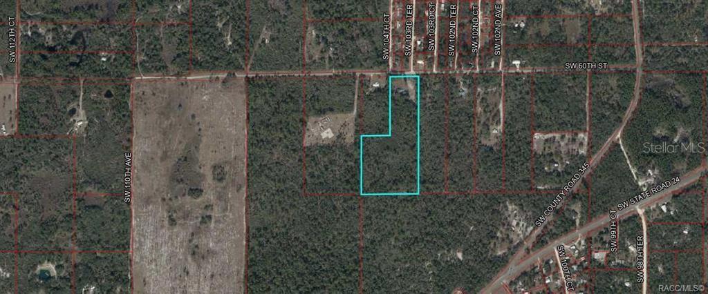 An aerial map shows a vacant, L-shaped parcel of land outlined in blue — 10450 SW 60TH STREET, CEDAR KEY, FL