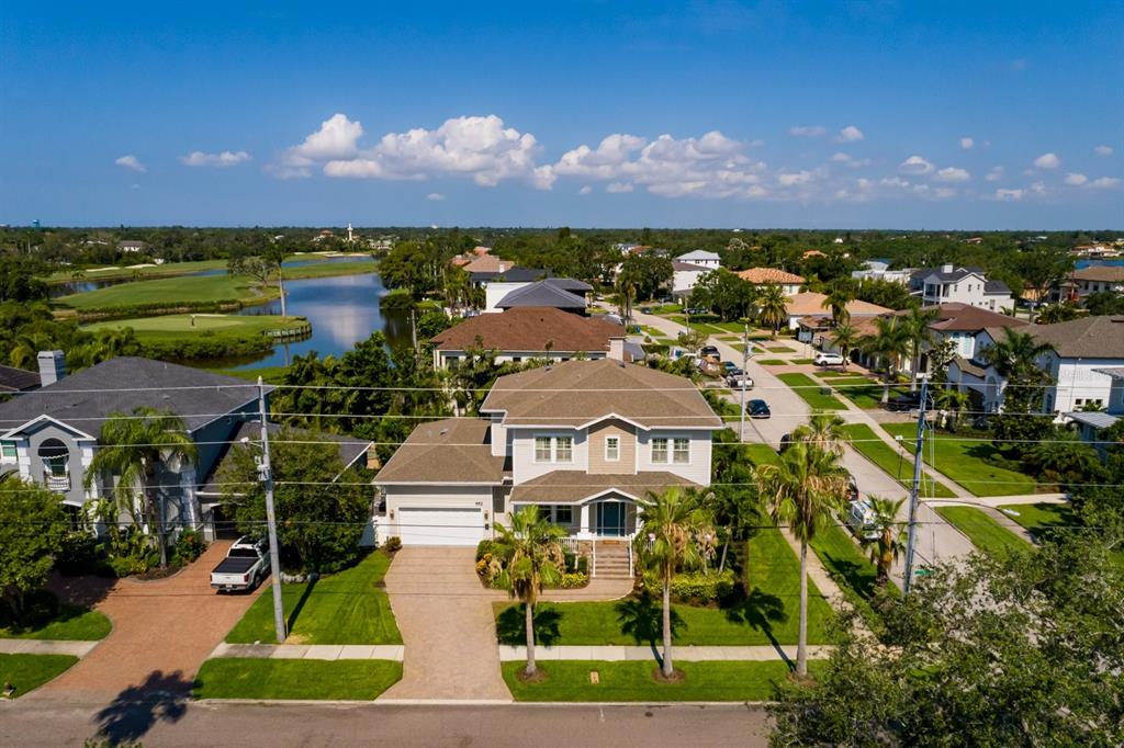 An aerial view of a two-story suburban house with a driveway and palm trees — 852 CORDOVA BOULEVARD NE, ST PETERSBURG, FL