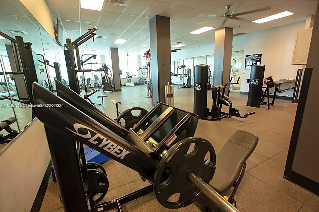 A gym room features multiple Cybex weight machines and exercise equipment on a tiled floor — 2501 S Ocean Dr # 429, Hollywood FL 33019, HOLLYWOOD, FL