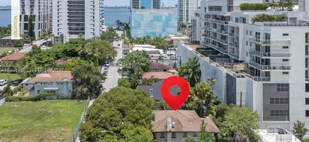 An aerial view shows a house with a red pin marker in a residential neighborhood — 314 NE 26th Ter, Miami FL 33137, MIAMI, FL