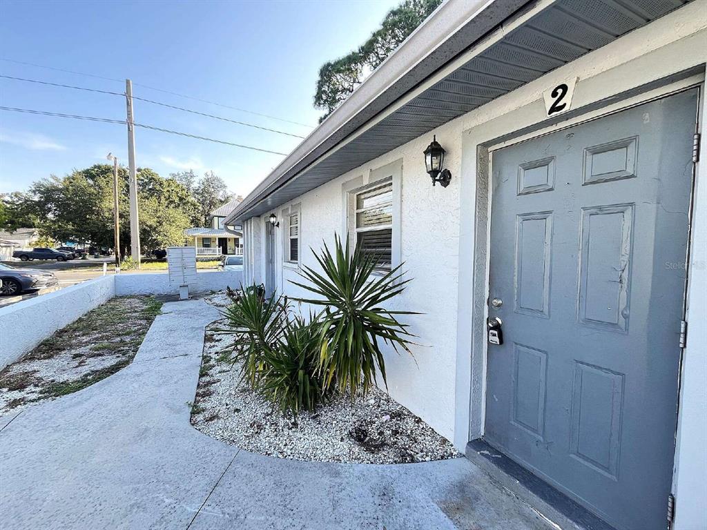 A gray door labeled with the number two sits on the exterior of a building — 2519 9TH AVENUE W UNIT 2, BRADENTON, FL