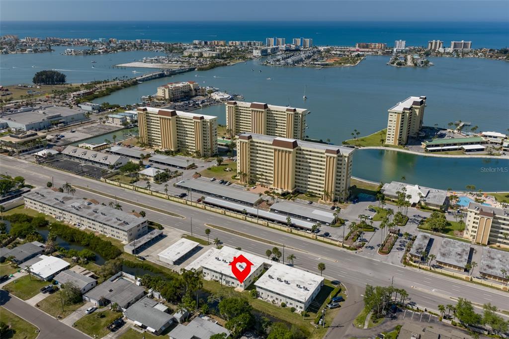 An aerial view shows a low-rise residential building marked with a red location pin — 4565 DUHME ROAD UNIT 106, MADEIRA BEACH, FL
