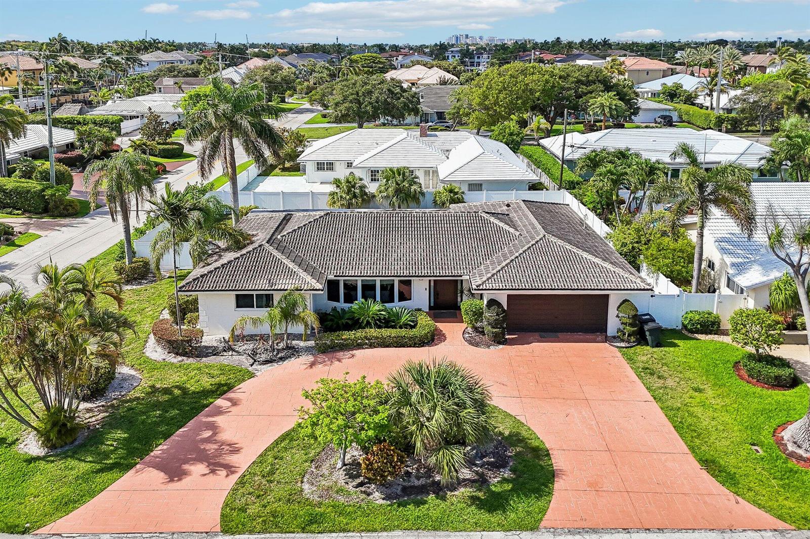An aerial view of a single-story house with a tiled roof and a circular driveway — 2940 NE 39th Court, Lighthouse Point FL 33064, LIGHTHOUSE POINT, FL