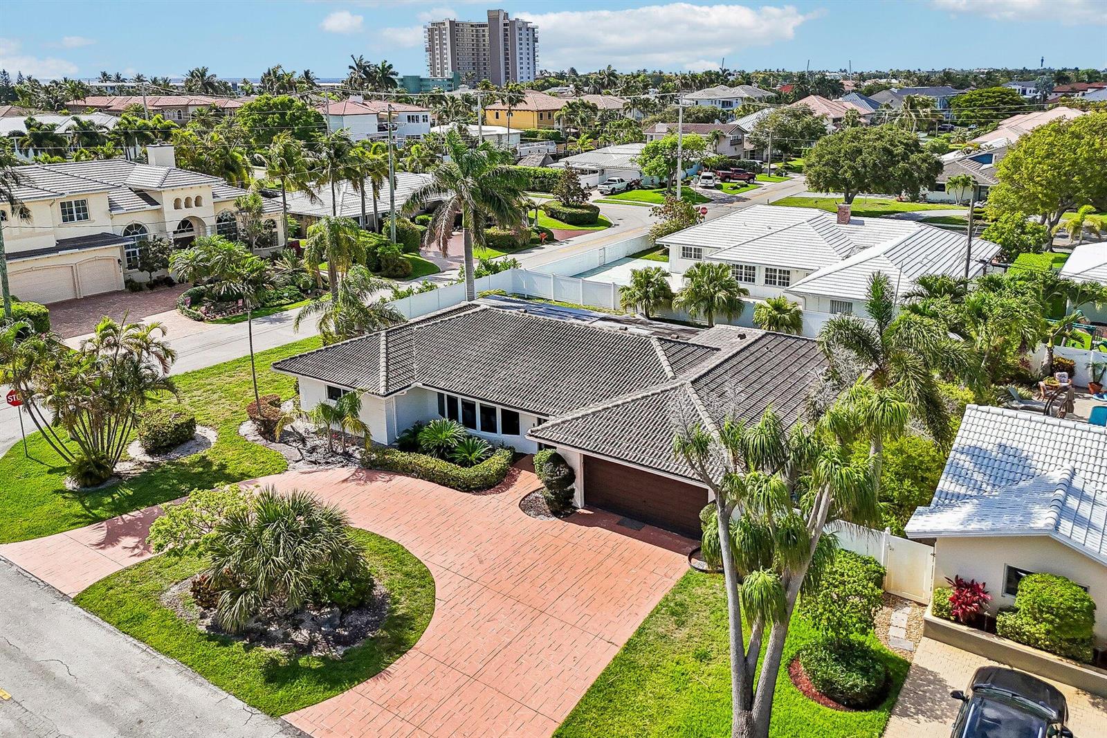 An aerial view of a single-story house with a tiled roof and a brick driveway — 2940 NE 39th Court, Lighthouse Point FL 33064, LIGHTHOUSE POINT, FL