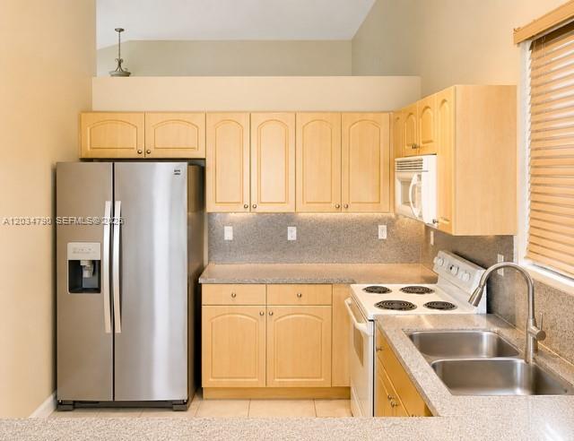 A kitchen features light wood cabinets, stainless steel appliances, and a double-basin sink — 5420 SW 134th Ave # 0, Miramar FL 33027, MIRAMAR, FL