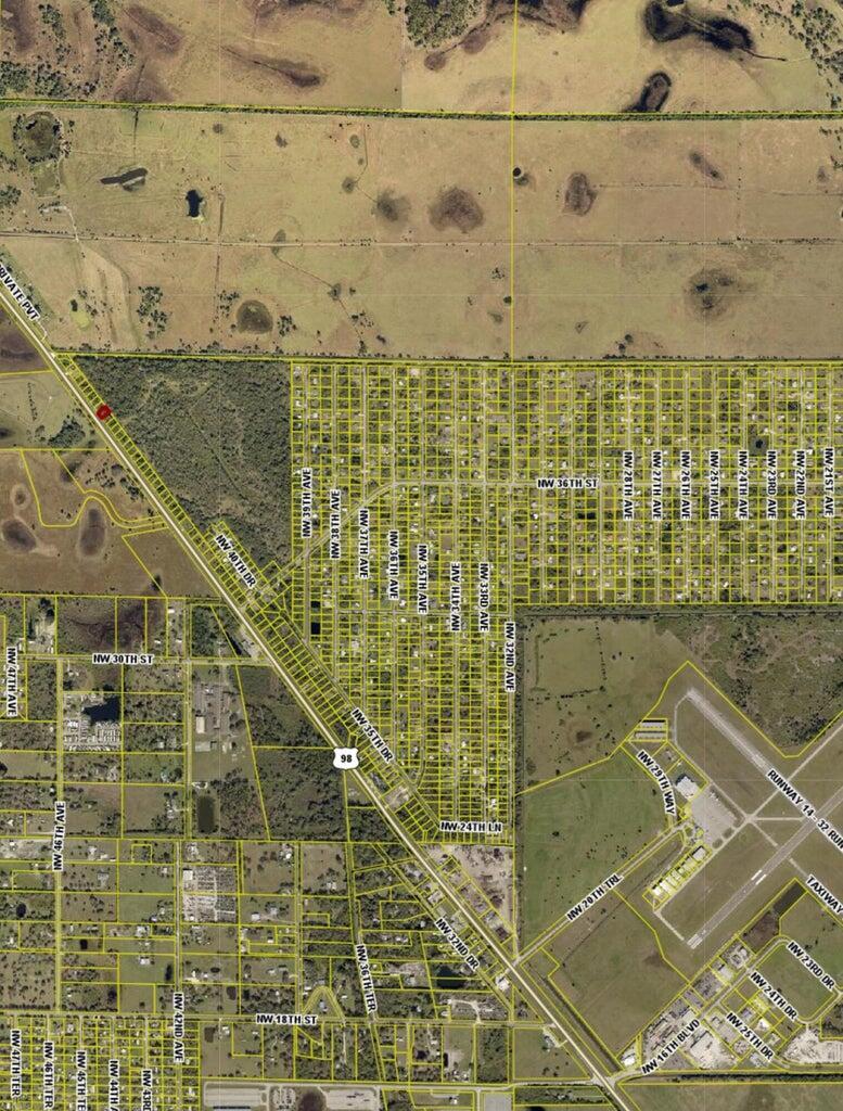 This is an aerial map showing a grid of residential lots near an airport runway — 3804 Hwy 98 N, Okeechobee FL 34972, OKEECHOBEE, FL