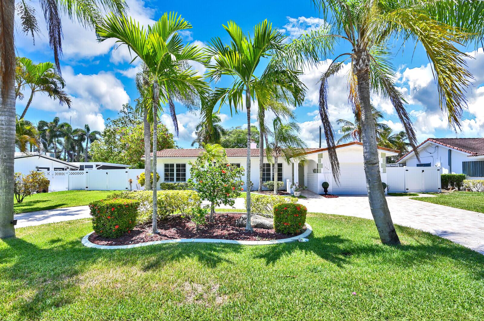 A single-story white house with a tiled roof sits behind a landscaped lawn and palm trees — 904 SE 12th Street, Deerfield Beach FL 33441, DEERFIELD BEACH, FL