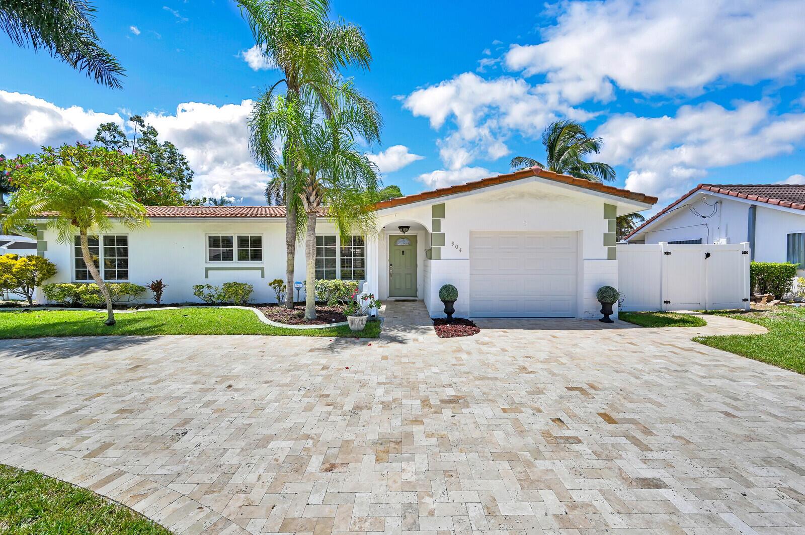 A single-story white house with a tiled roof, palm trees, and a paved driveway — 904 SE 12th Street, Deerfield Beach FL 33441, DEERFIELD BEACH, FL