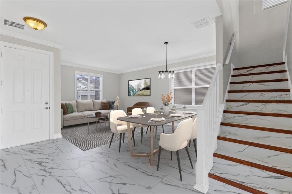 A dining area and living room feature marble-look tile flooring and a staircase with wood treads — 10408 CHORLTON CIRCLE, ORLANDO, FL