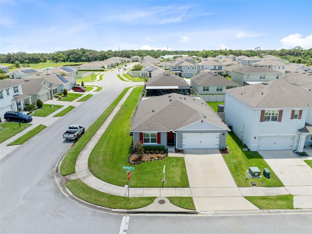 An aerial view shows a suburban house with a gray roof and white garage — 2001 APALACHICOLA LANE, SANFORD, FL