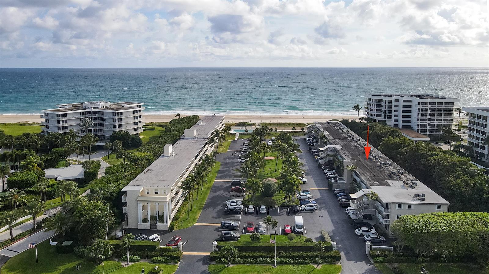 An aerial view shows two multi-story apartment buildings with parking lots near the ocean — 2565 S Ocean Boulevard # 208, Palm Beach FL 33480, PALM BEACH, FL