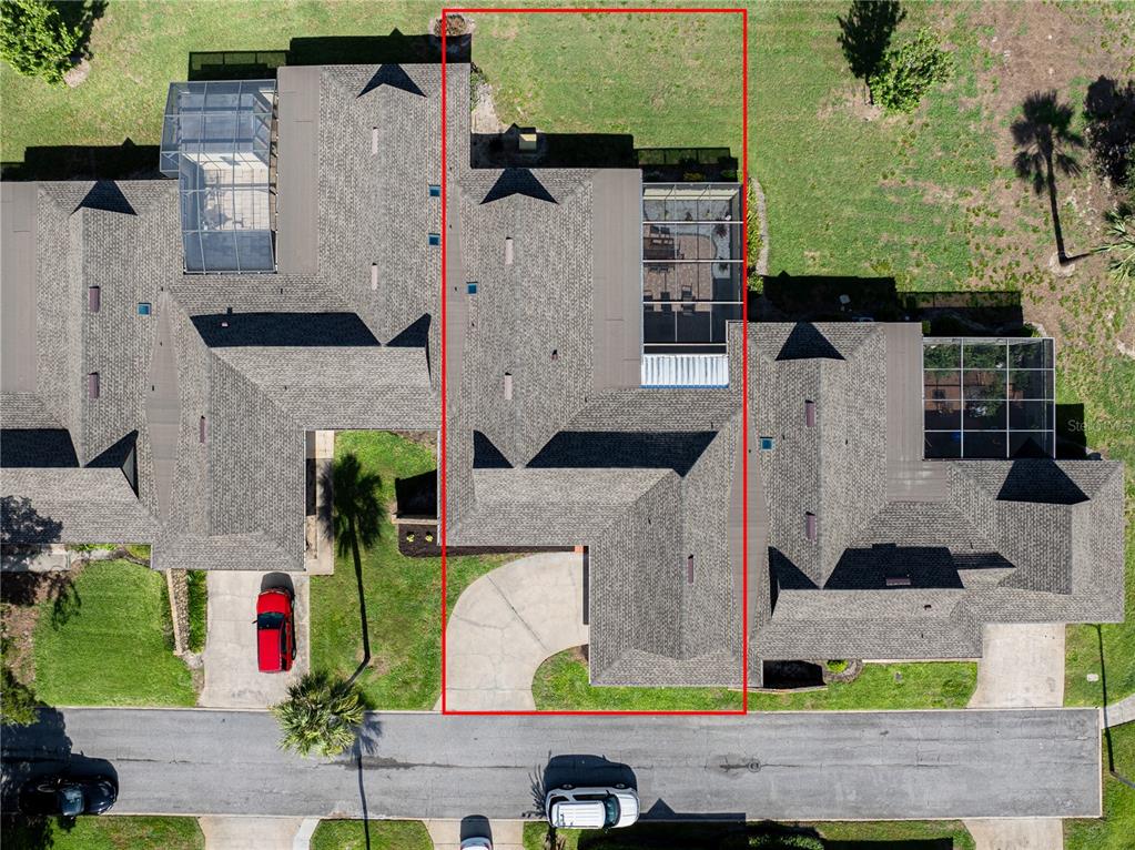 An aerial view shows a residential property with a red outline highlighting a specific unit — 1408 MAGELLAN CIRCLE UNIT 103, ORLANDO, FL