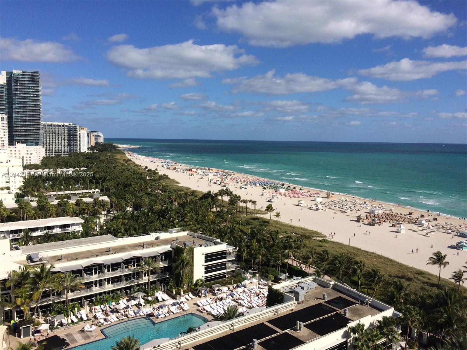 An elevated view of a beach resort featuring a swimming pool and sandy shoreline — 100 Lincoln Rd # 1637, Miami Beach FL 33139, MIAMI BEACH, FL