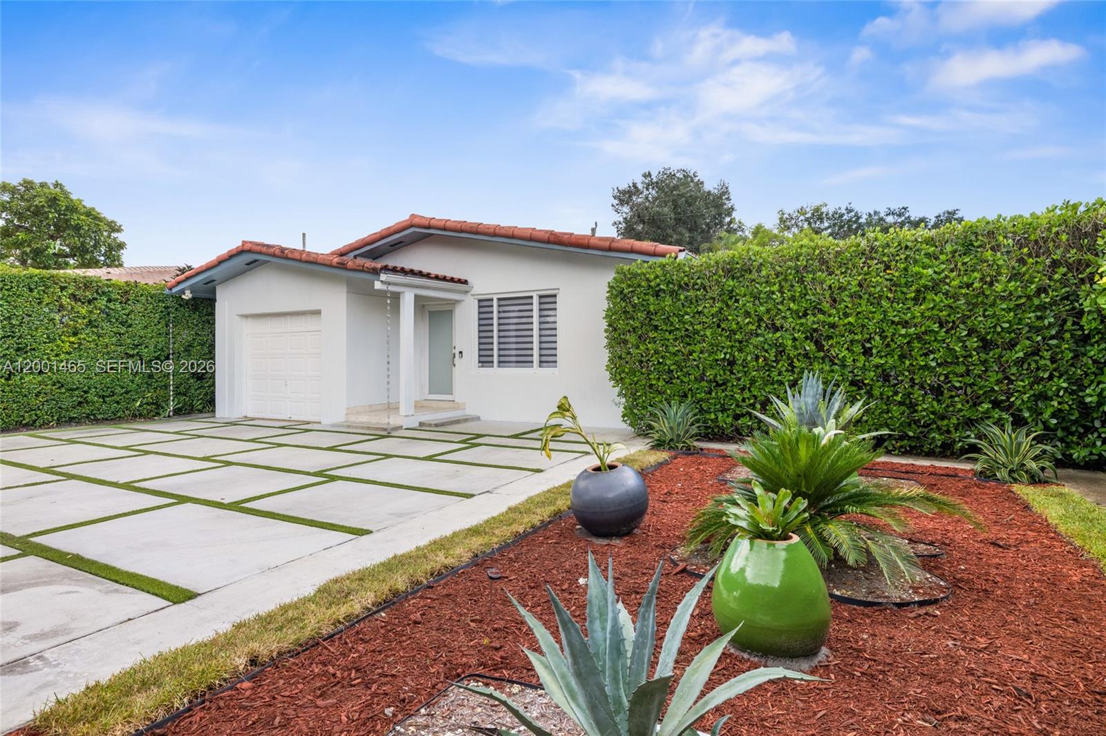 A single-story house with a tiled roof, white exterior, and a modern concrete paver driveway — 2121 Red Rd # 0, Coral Gables FL 33155, CORAL GABLES, FL