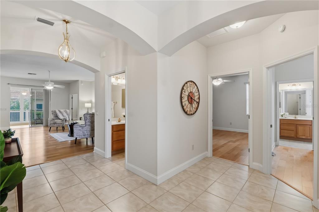 A tiled foyer leads into a living area and two bedrooms with attached bathrooms — 1570 GIFFORD COURT, THE VILLAGES, FL