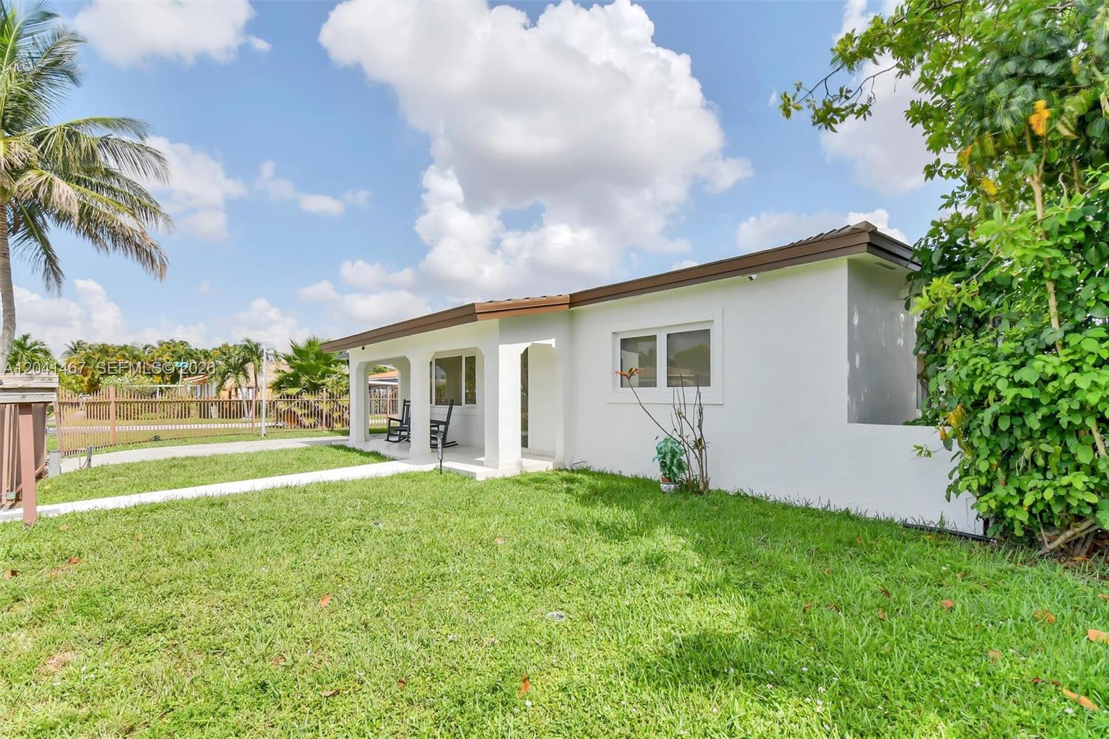 A white single-story house with a covered porch and a grassy front yard — 241 W 48th St, Hialeah FL 33012, HIALEAH, FL