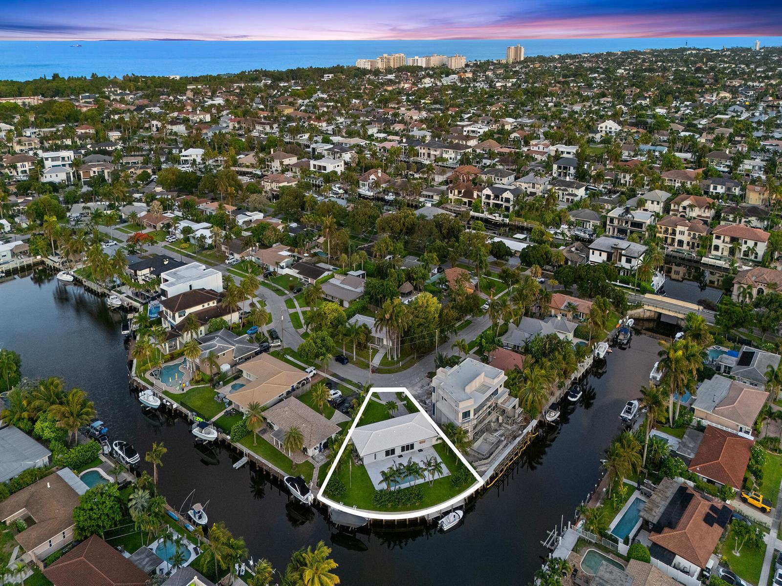 An aerial view shows a waterfront house with a pool on a triangular lot — 2421 NE 50th Street, Lighthouse Point FL 33064, LIGHTHOUSE POINT, FL