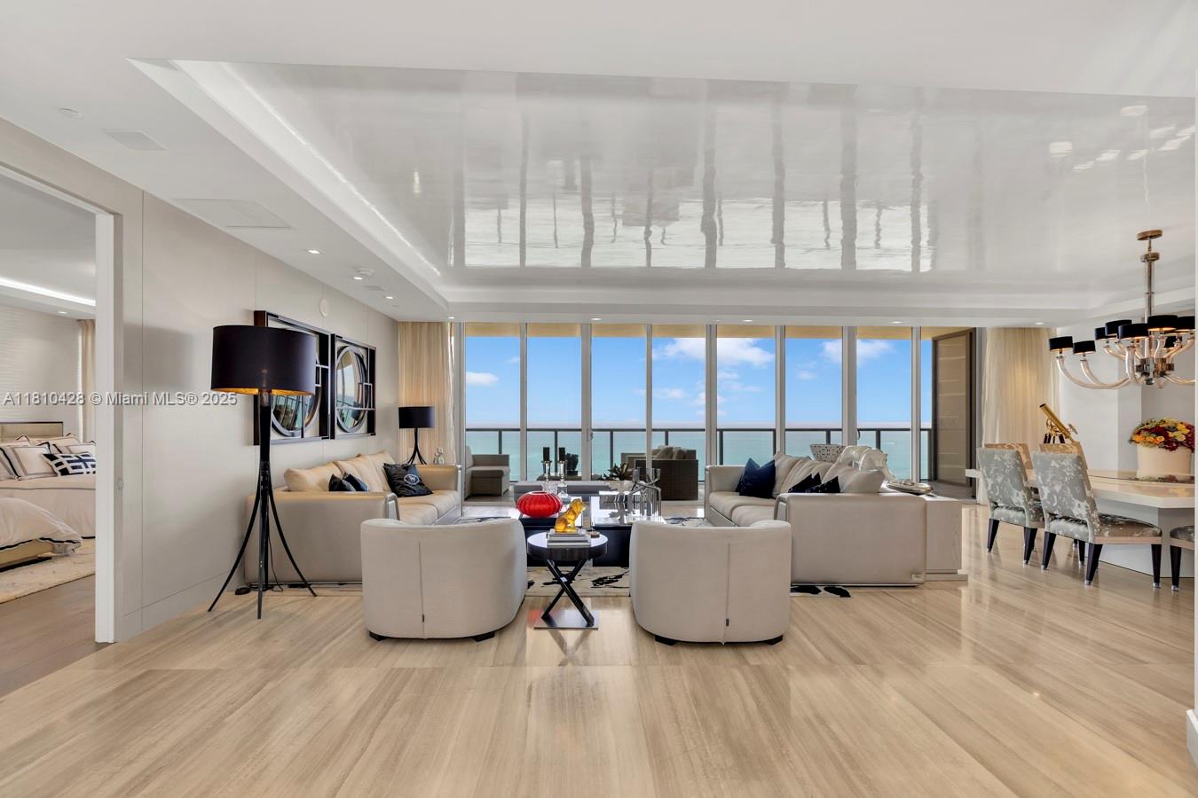 A bright, modern living and dining area features floor-to-ceiling windows overlooking the ocean — 9701 Collins Ave # 2403S, Bal Harbour FL 33154, BAL HARBOUR, FL