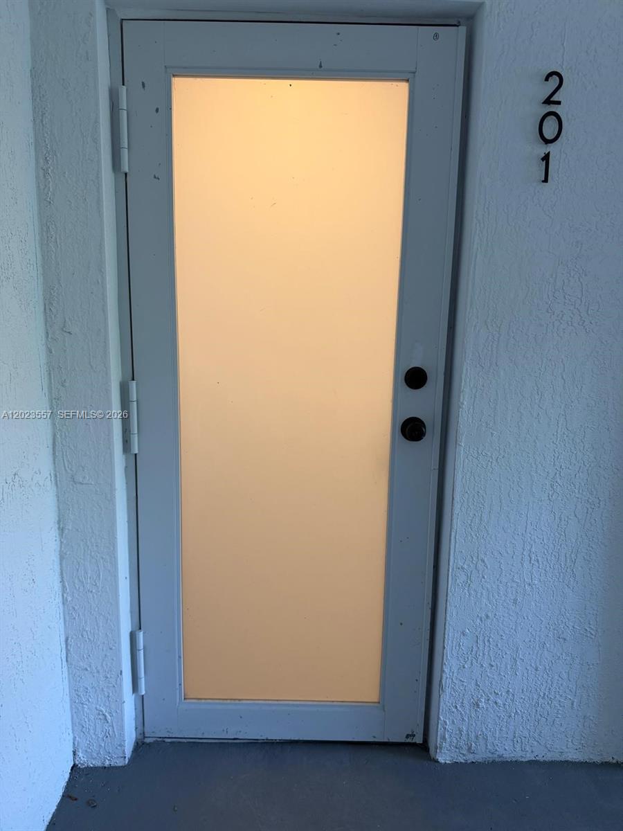 A white door with a frosted glass panel and the number 201 mounted beside it — 147 Nw 59th St # 201, Miami FL 33127, MIAMI, FL