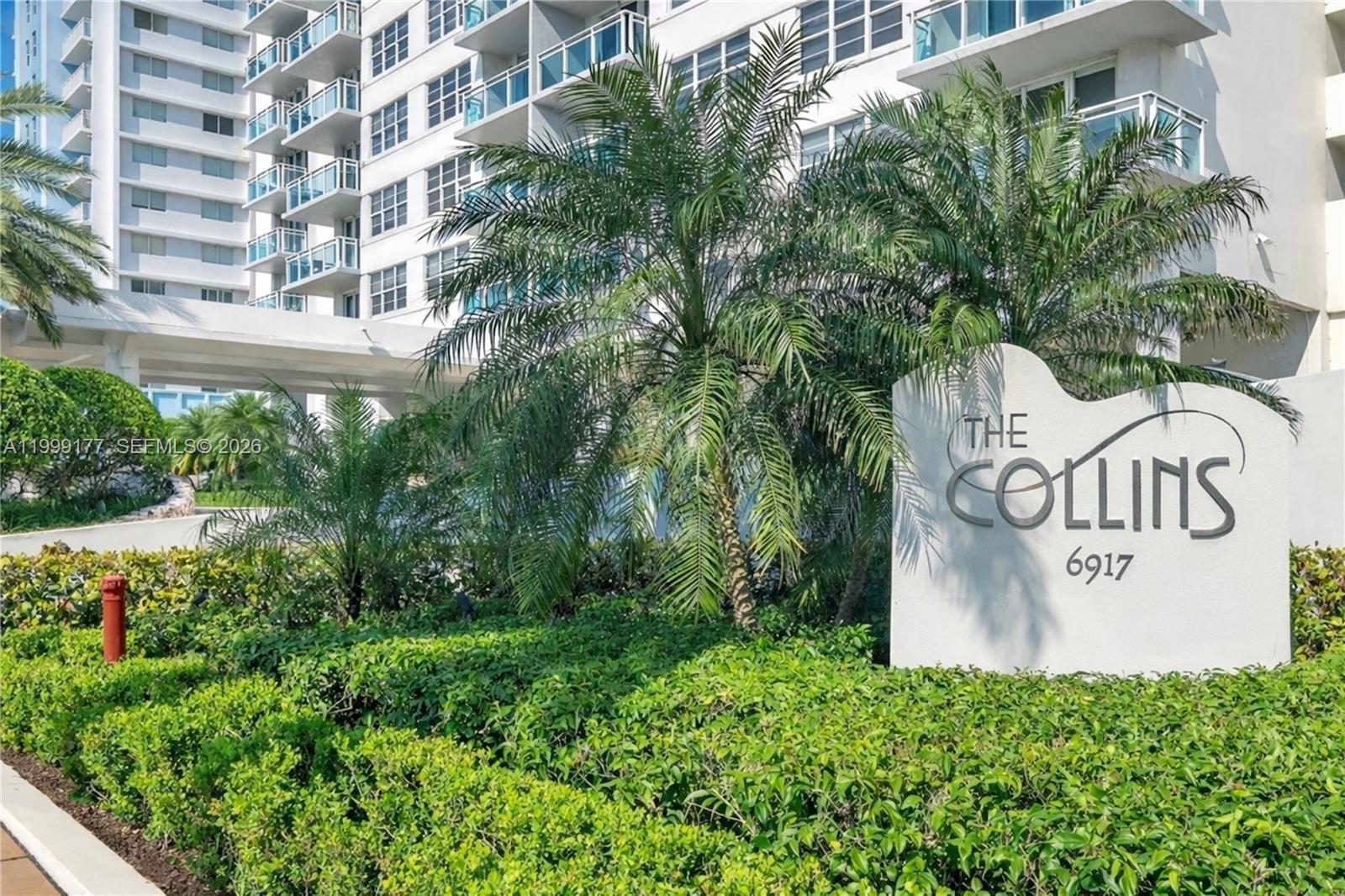 A white sign for The Collins stands in front of a multi-story residential building — 6917 Collins Ave # 1611, Miami Beach FL 33141, MIAMI BEACH, FL