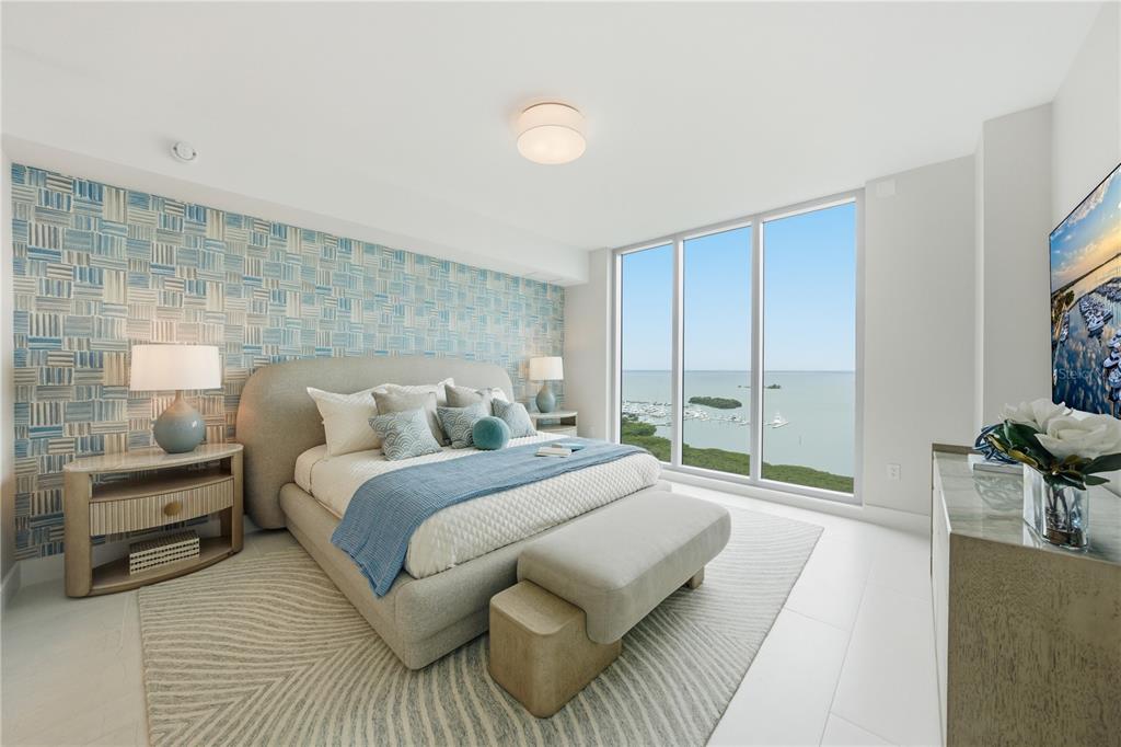A rooftop pool deck features lounge chairs, umbrellas, and a view of the sunset — 5713 BOWEN DANIEL DRIVE UNIT 1002, TAMPA, FL