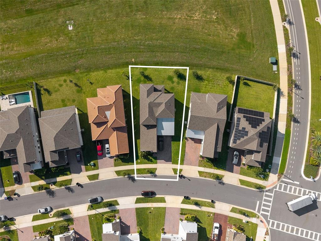 An aerial view shows a single-family home with a white outline on its lot — 5211 CITRUS LEAF BOULEVARD, WINTER GARDEN, FL