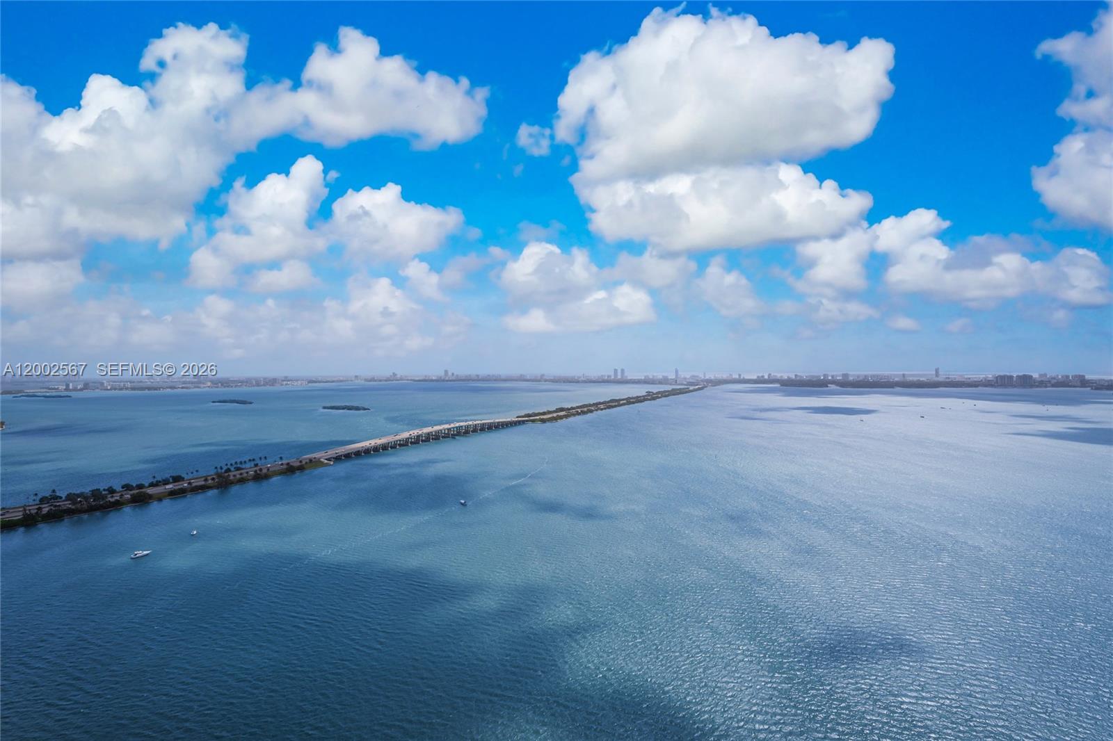 An aerial view shows a long bridge spanning across a large body of water — 2900 NE 7th Ave # 4003, Miami FL 33137, MIAMI, FL