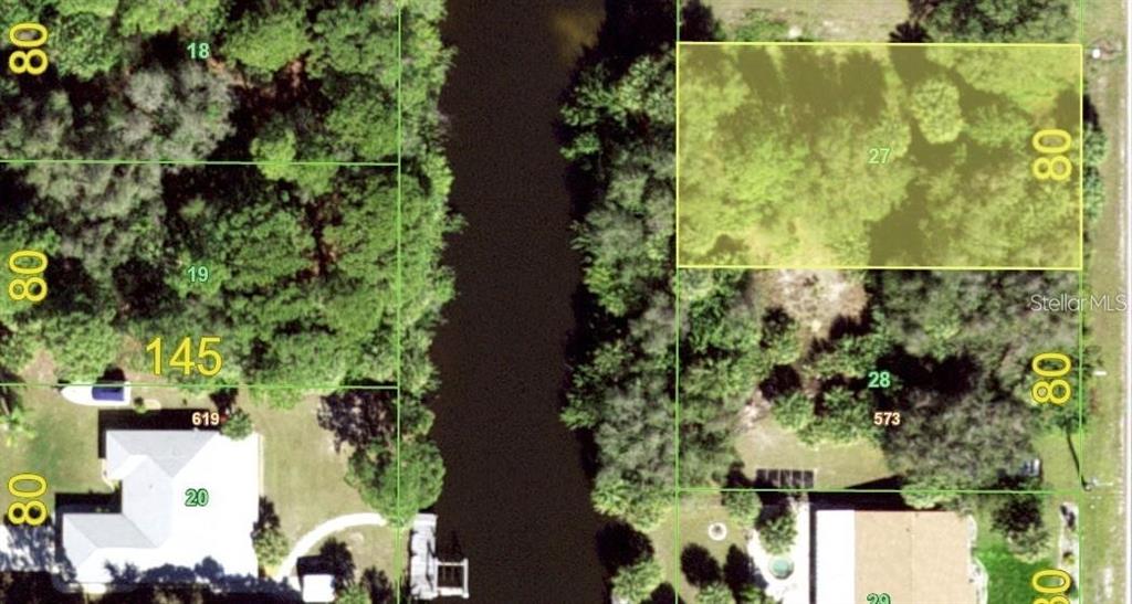 This is an aerial map showing a highlighted rectangular lot adjacent to a canal — 2041 CEDARWOOD STREET, PORT CHARLOTTE, FL